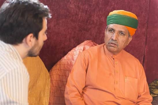 Shri Arjun Ram Meghwal in conversation in a domestic setting in Rajasthan.